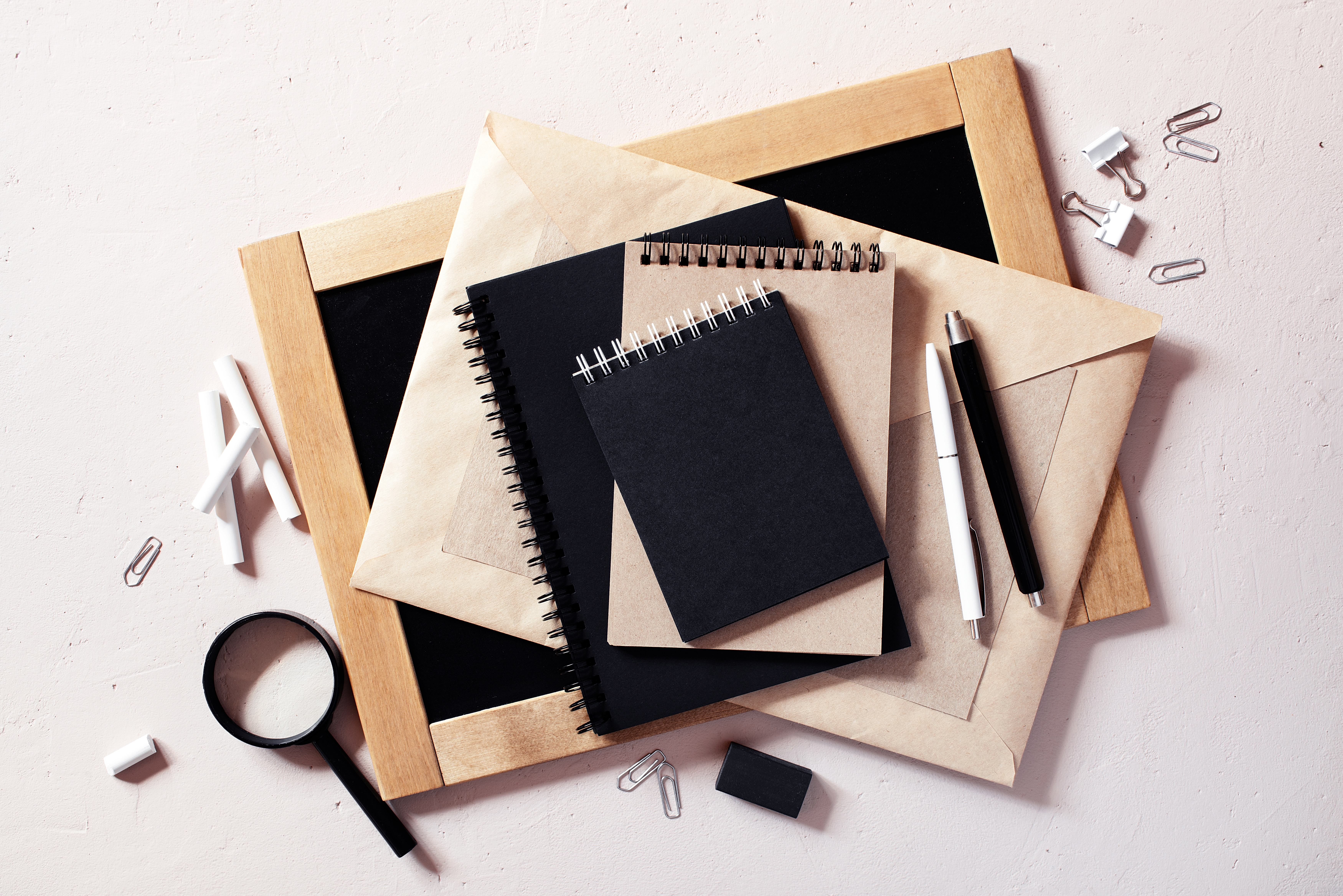 books with magnifying glass