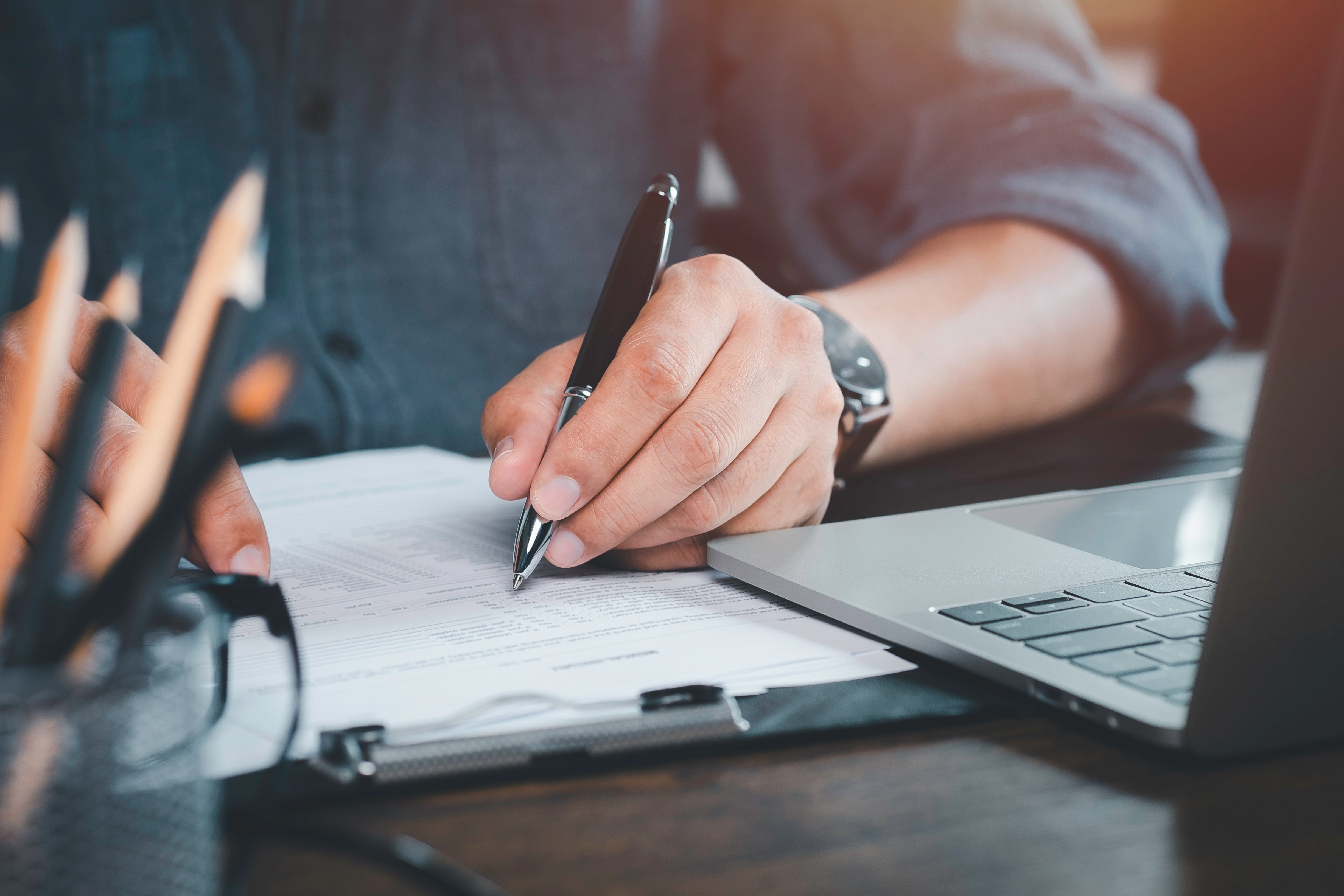 pen writing on paper